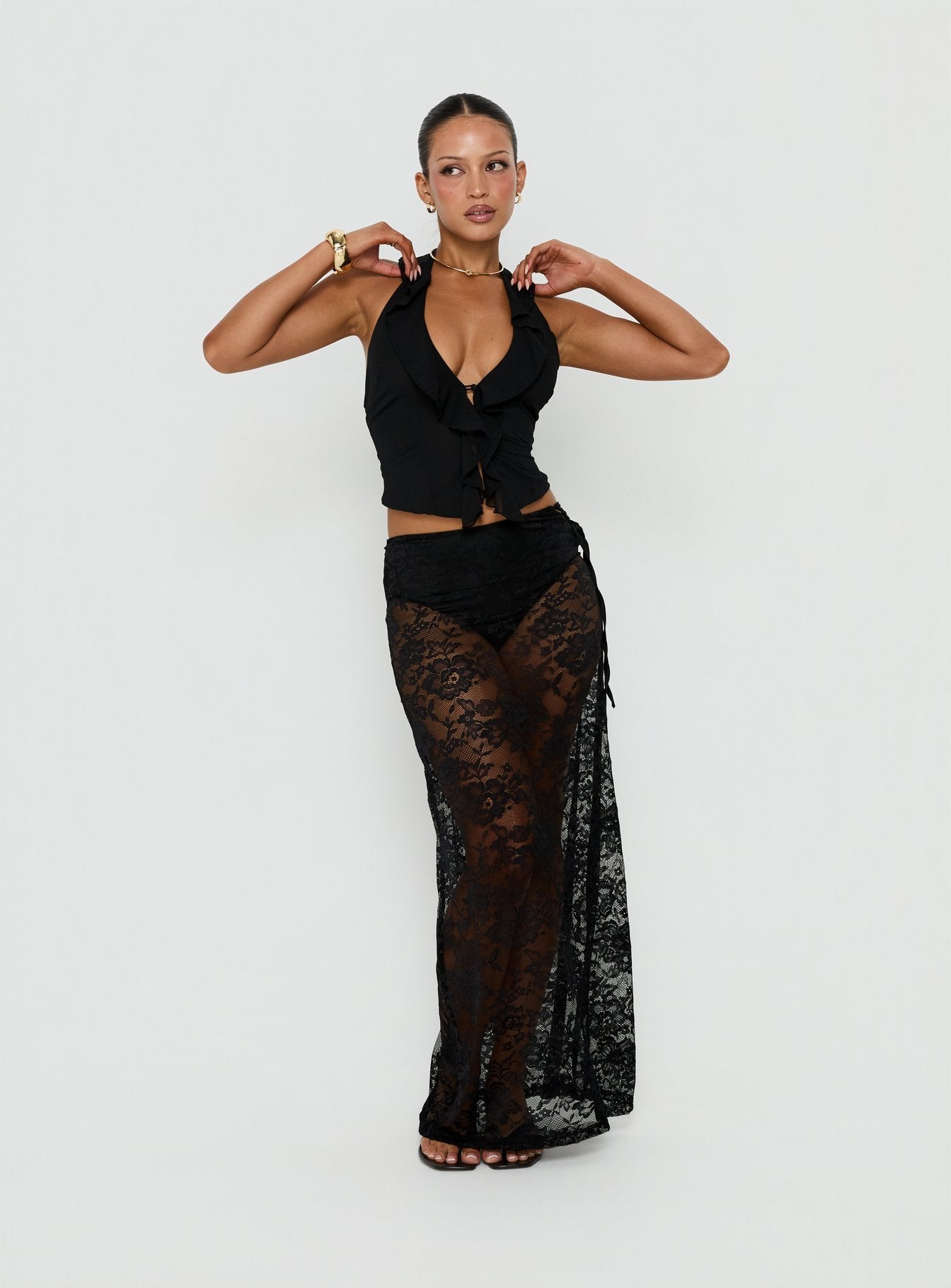 Showcasing the Marenya Lace Maxi Skirt Black in womens-skirts, featuring fitted silhouette with floral details and a-line shape front view of model wearing Princess Polly
