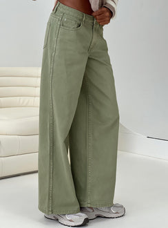 side view of model wearing Princess Polly Ramos Low Rise Denim Jeans Sage Mid Rise Jeans Jeans 