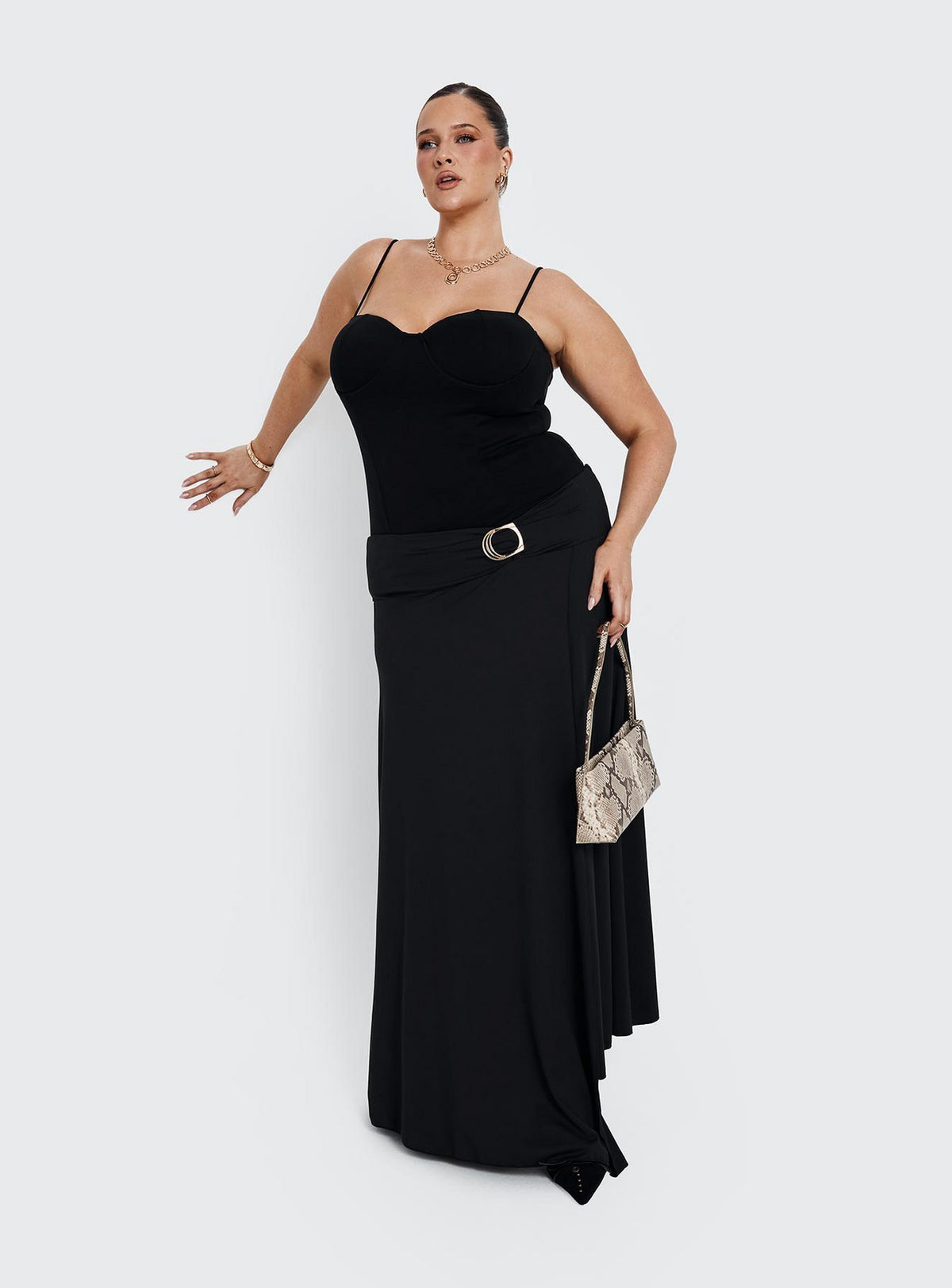 Featuring the Nola Hardware Slit Maxi Skirt Black Curve in womens-skirts with a fitted aline silhouette and lace hem front view of model wearing