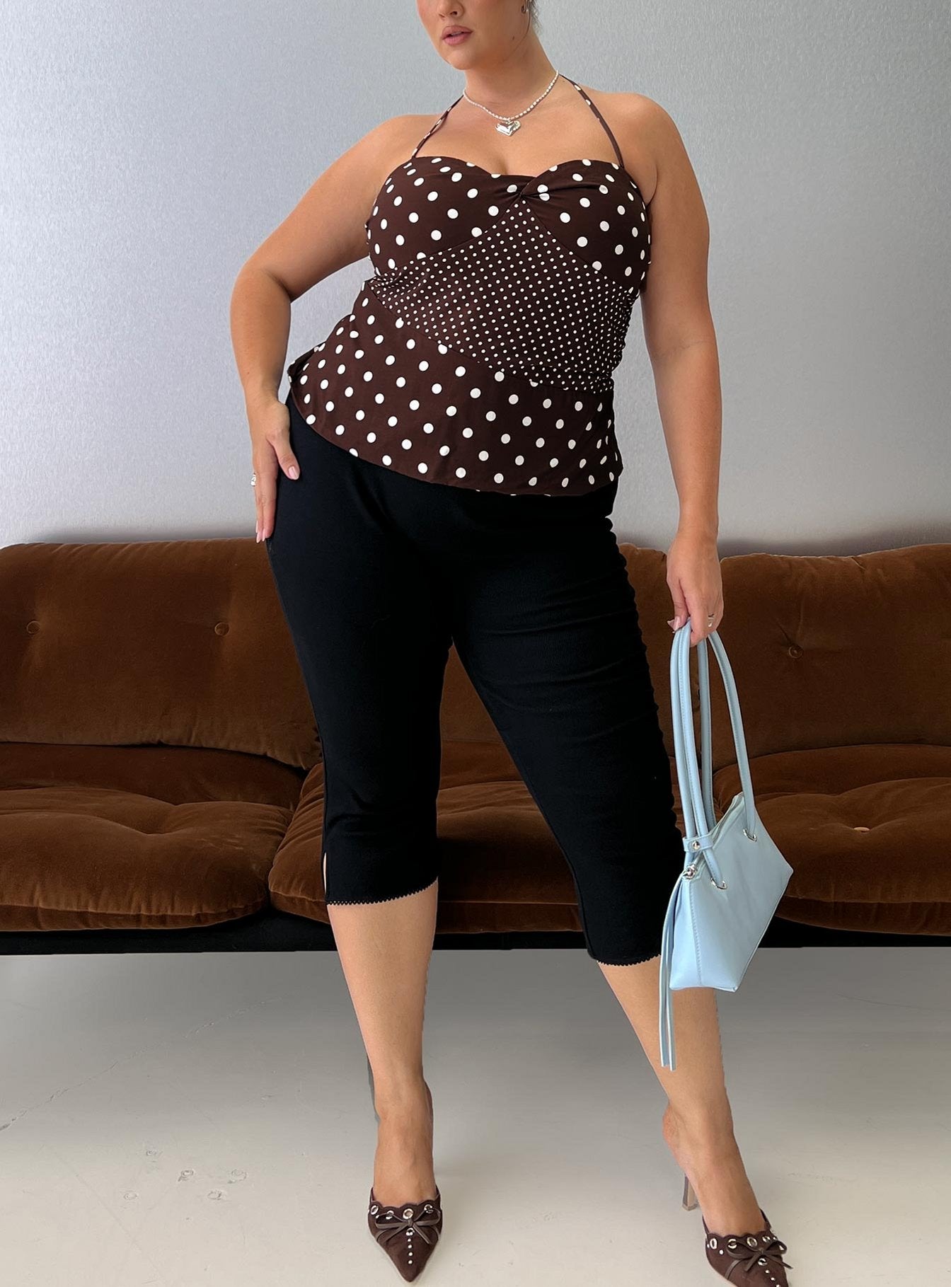 front view of model wearing Princess Polly Baseline Rib Capri Pants Black Curve Mid Rise Pants 
