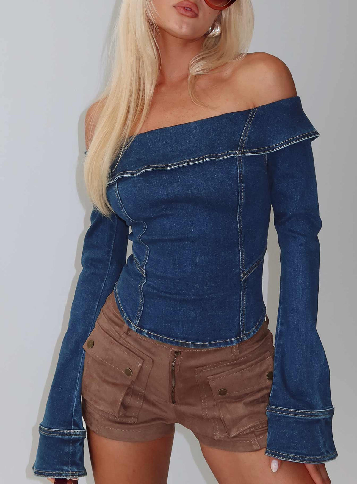 side view of model wearing Princess Polly In The Crowd Off Shoulder Top Dark Denim Full Sleeves straight 