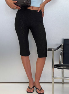 front view of model wearing Princess Polly Samaira Capri Pant Black Anglaise Mid Rise Pants 