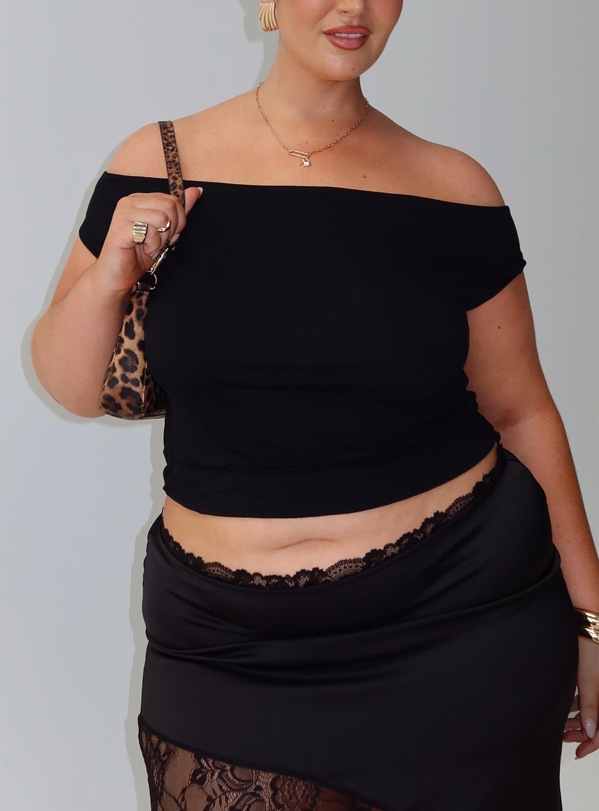 front view of model wearing Princess Polly Irina Multi-wear Top Black Curve Short Sleeves straight 