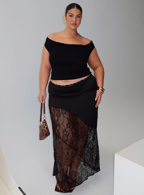   side view of model wearing Princess Polly Castelli Lace Maxi Skirt Black Curve Maxi 