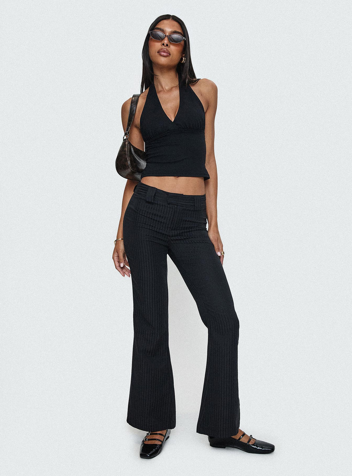 front view of model wearing Princess Polly Jinxed Pant Black Low Rise Pants Pants 