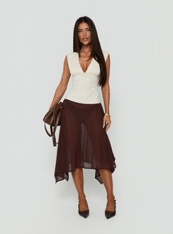 Featuring the Asali Asymmetrical Midi Skirt Chocolate womens-skirts in midi length front view of model wearing Princess Polly