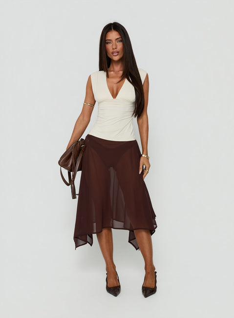 Featuring the Asali Asymmetrical Midi Skirt Chocolate womens-skirts in midi length front view of model wearing Princess Polly