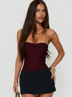 Featuring the Cintta Strapless Bandage Bodysuit Burgundy in sleeveless womens-bodysuit front view of model wearing Princess Polly