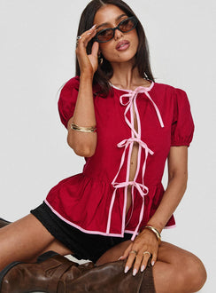 side view of model wearing Princess Polly Ryota Blouse Red/pink Short Sleeves Crew Neck 