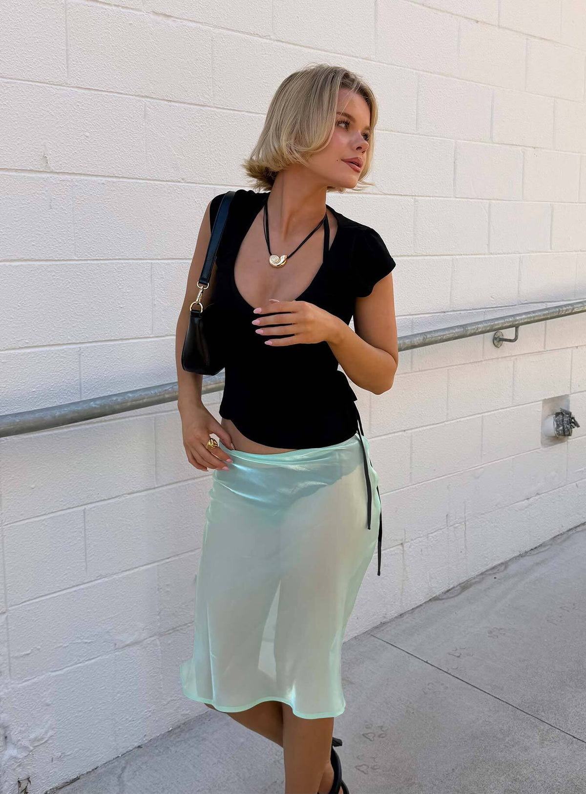 Showcasing the Sidori Sheer Midi Skirt Jelly Mint in womens-skirts with midi length side view of model wearing Princess Polly