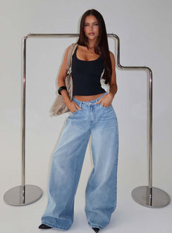Showcasing Naylor Mid Rise Wide Leg Jeans Light Wash Denim Light Blue Wash Petite in womens-jeans with mid-rise front view of model wearing