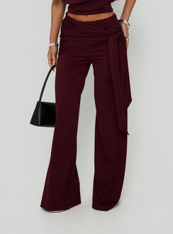 Featuring the Hadlia Tie Waist Pants Burgundy womens-regular-pants with high-rise detail front view of model wearing