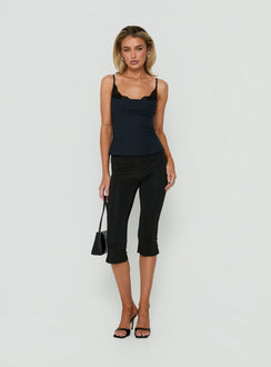 Showcasing Avedon Foldover Waist Capri Pants in Black womens regular pants with high-rise front view of model wearing Princess Polly