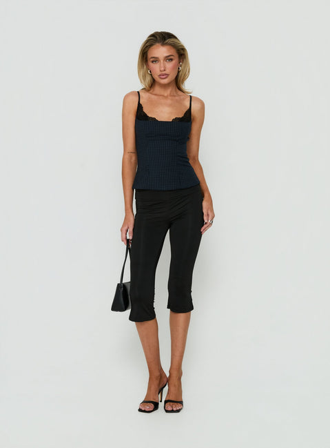 Showcasing Avedon Foldover Waist Capri Pants in Black womens regular pants with high-rise front view of model wearing Princess Polly