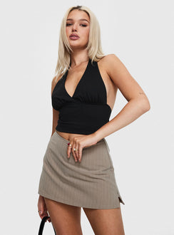 side view of model wearing Princess Polly Gigi Skort Beige Pinstripe High Waisted Shorts 