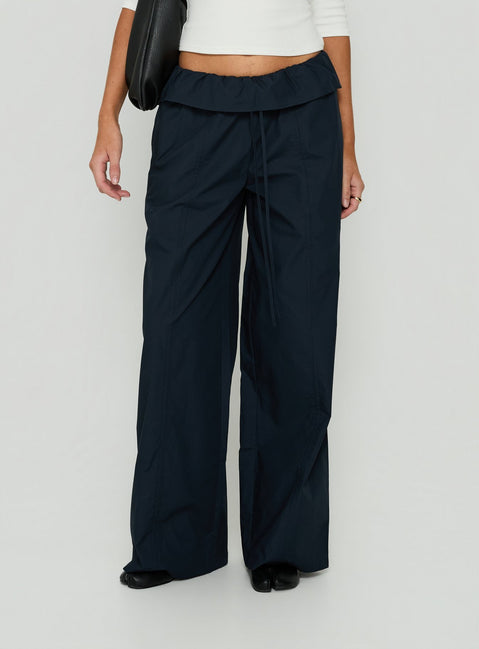 Showcasing the Amaiza Frill Drawstring Straight Leg Pants Navy in womens-regular-pants with high-rise front view of model wearing Princess Polly