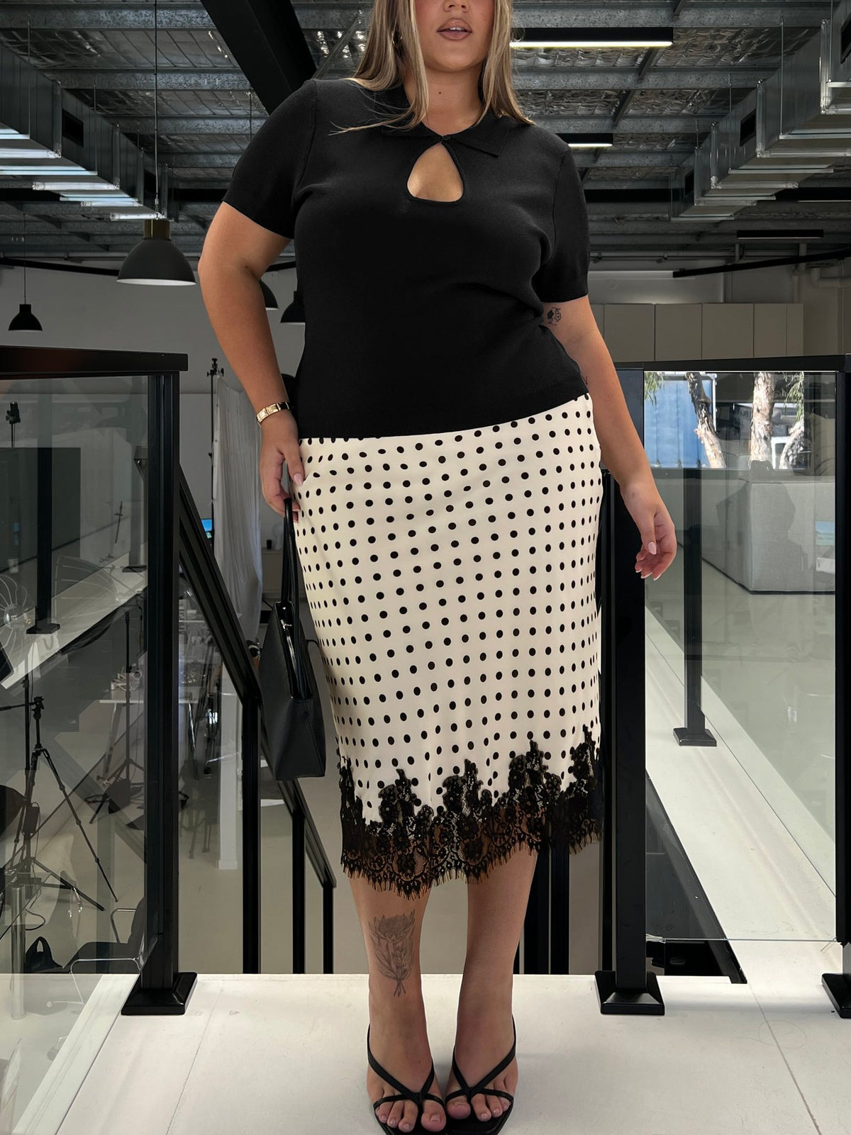 Showcasing the Downtown Scene Lace Trim Maxi Skirt Cream Polka Curve in womens-skirts with midi length front view of model wearing Princess Polly