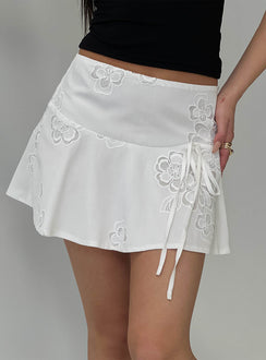   side view of model wearing Princess Polly Drisana Tie Detail Embroidered Mini Skirt White Mini Skirts 
