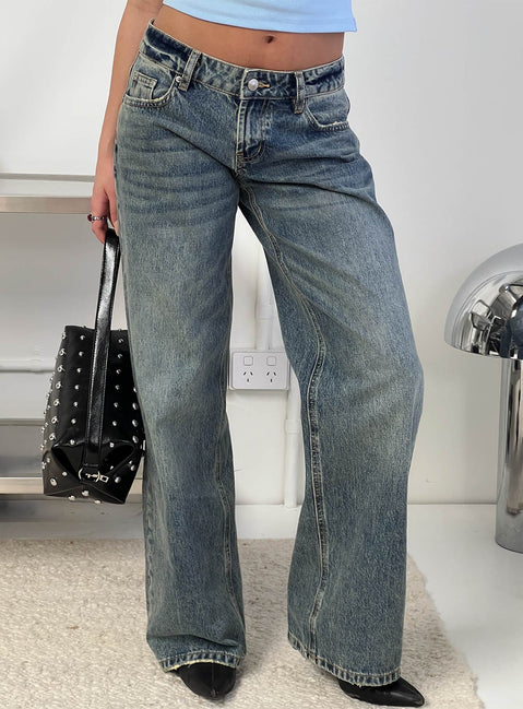 front view of model wearing Princess Polly Zaralyn Low Rise Wide Leg Jeans Mid Blue Wash Low Rise Jeans 