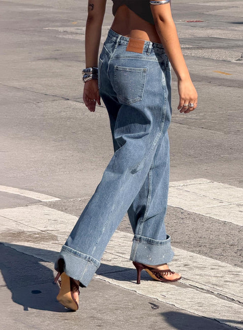 back view of model wearing Princess Polly Ramos Diamante Low Rise Wide Leg Jeans Washed Mid Blue Low Rise Jeans 