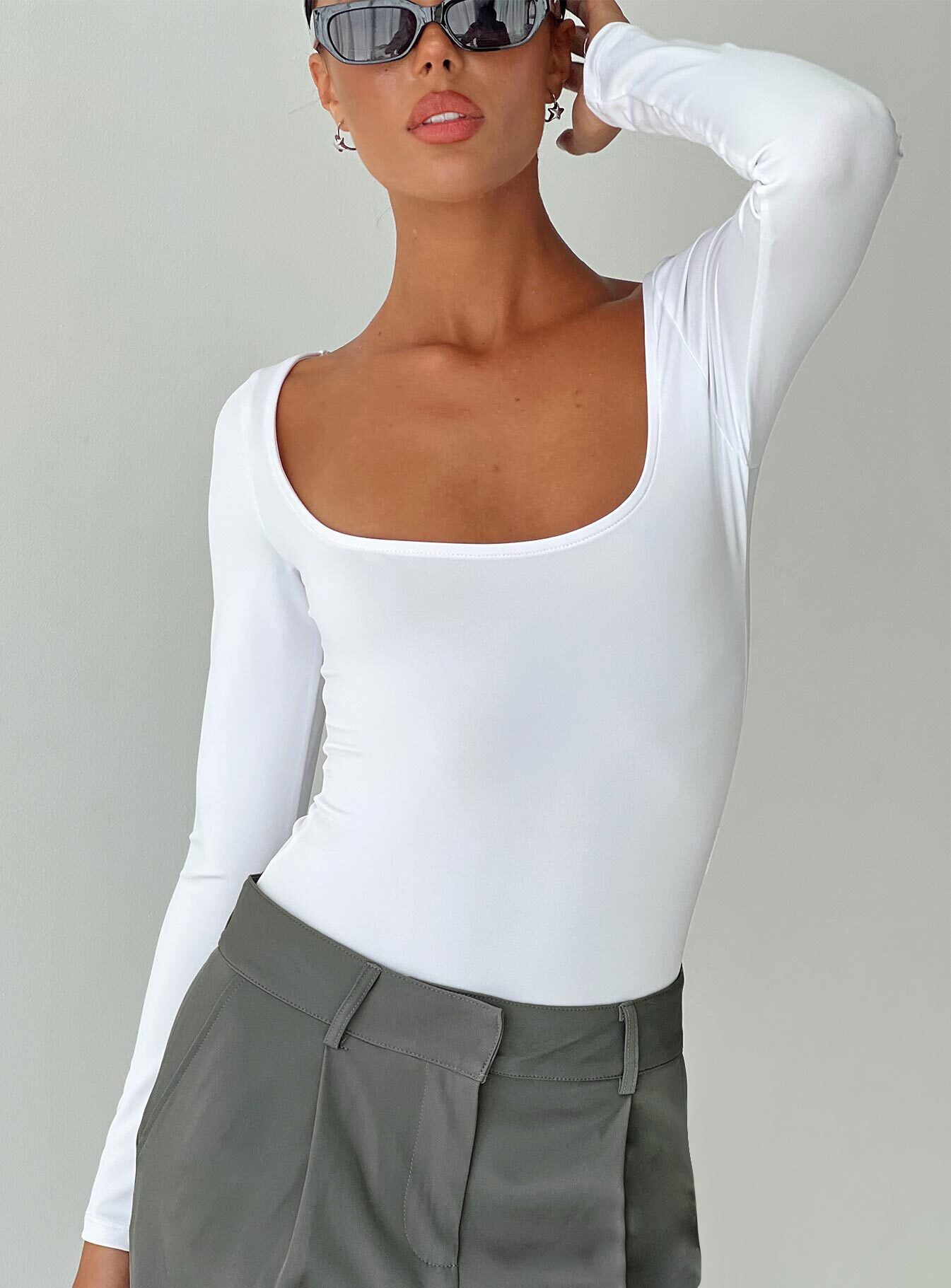 front view of model wearing Princess Polly Ellery Bodysuit White Full Sleeves Square Neck 
