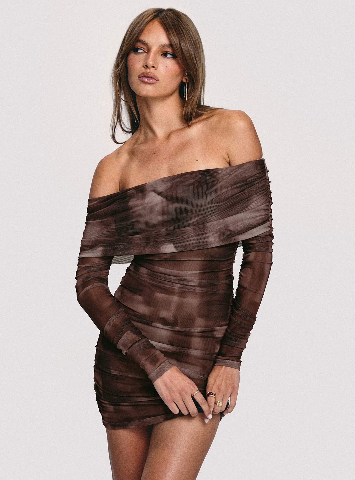 side view of model wearing Princess Polly Raquella Long Sleeve Mini Dress Brown Straight Neck 