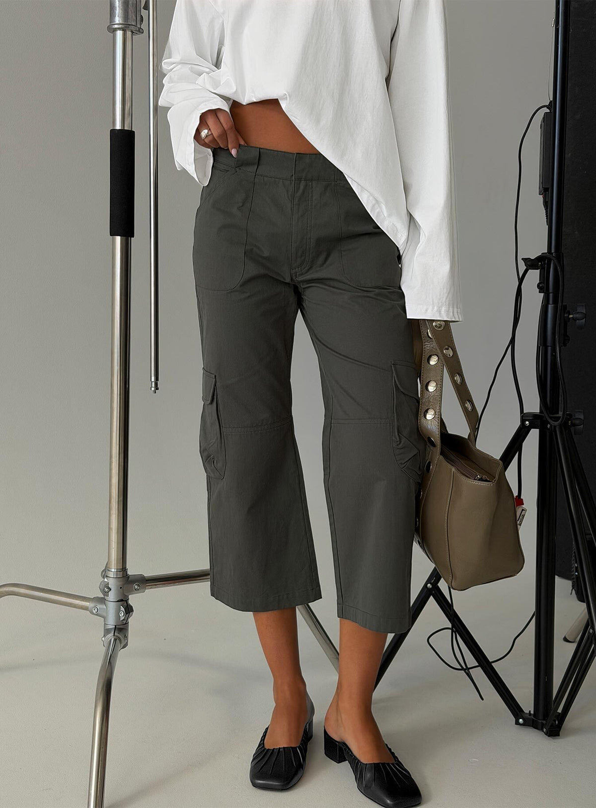 Featuring Indee Cropped Cargo Pants Charcoal in womens-regular-pants with mid-rise front view of model wearing Princess Polly