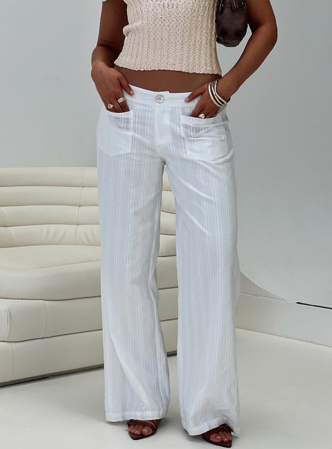 front view of model wearing Princess Polly Vendi Low Rise Pant White Petite Low Rise Pants 