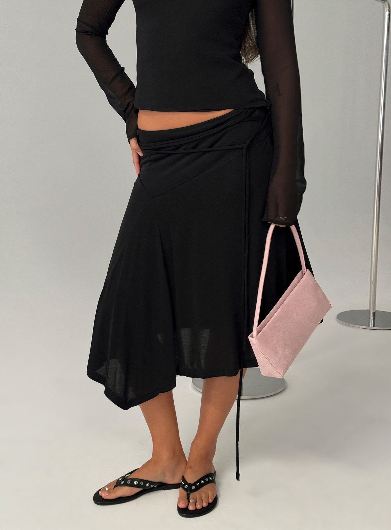   front view of model wearing Princess Polly Joaney Tie Side Jersey Midi Skirt Black Midi Skirts 