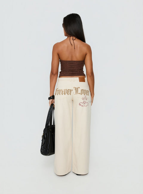 back view of model wearing Princess Polly Than Forever Love Graphic Denim Jeans Cream Low Rise Jeans Jeans 