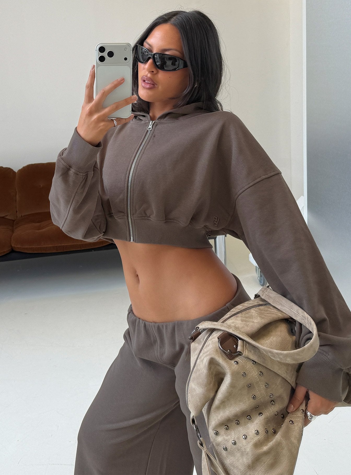 Showcasing the Lanna Fleece Zip Through Cropped Hoodie Grey in womens-jumpers with short length side view of model wearing Princess Polly