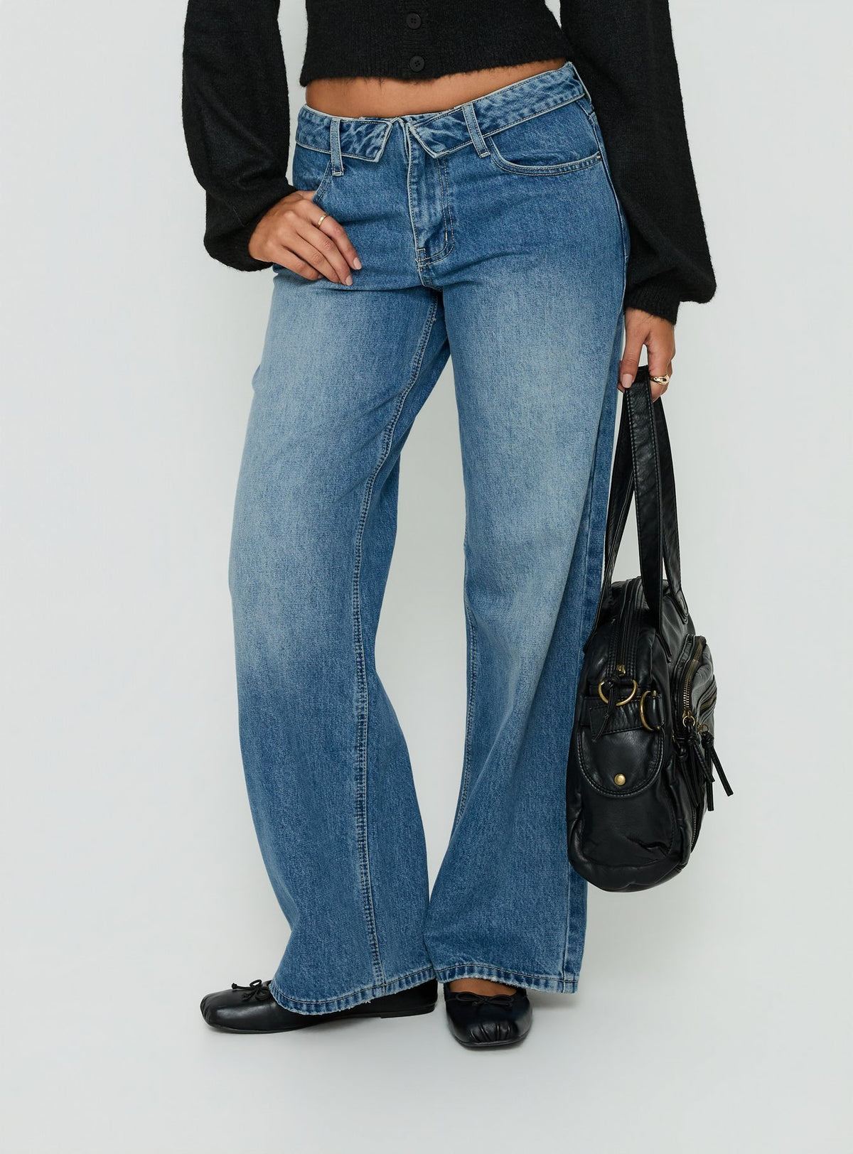 Discover the Serenitia Mid Rise Foldover Relaxed Jeans Vintage Mid Blue in womens-jeans with belt front view of model wearing Princess Polly