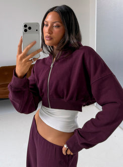 Featuring the Lanna Fleece Zip Through Cropped Hoodie in Plum, a short womens jumper with oversized fit and hood detail, front view of model wearing Princess Polly