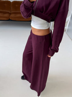 Showcasing Kaeya Fleece Wide Leg Low Rise Pants in Plum womens-regular-pants side view of model wearing Princess Polly