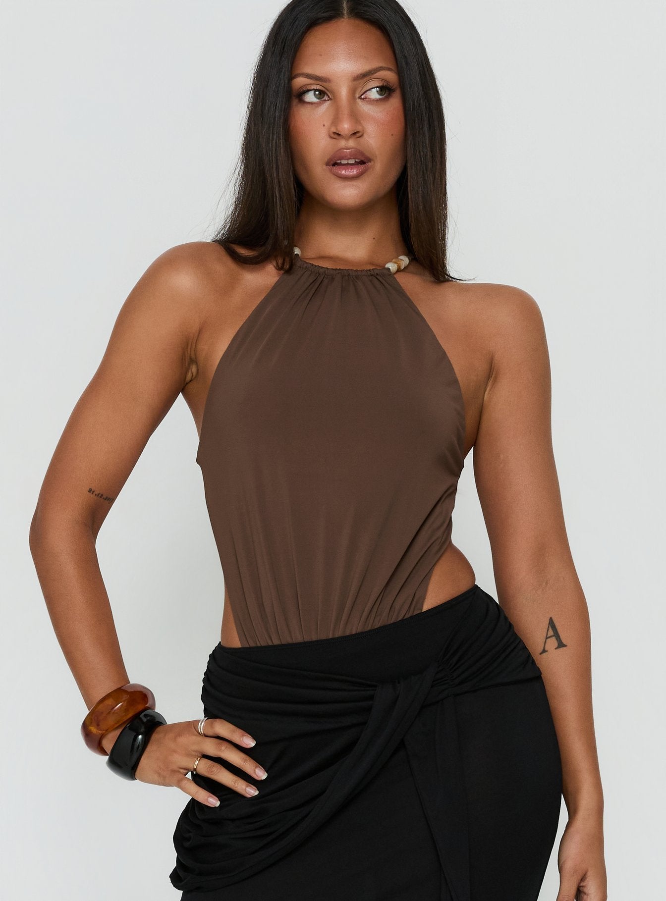Showcasing the Noree Bead Detail Bodysuit Mocha womens-bodysuit with sleeveless design front view of model wearing Princess Polly