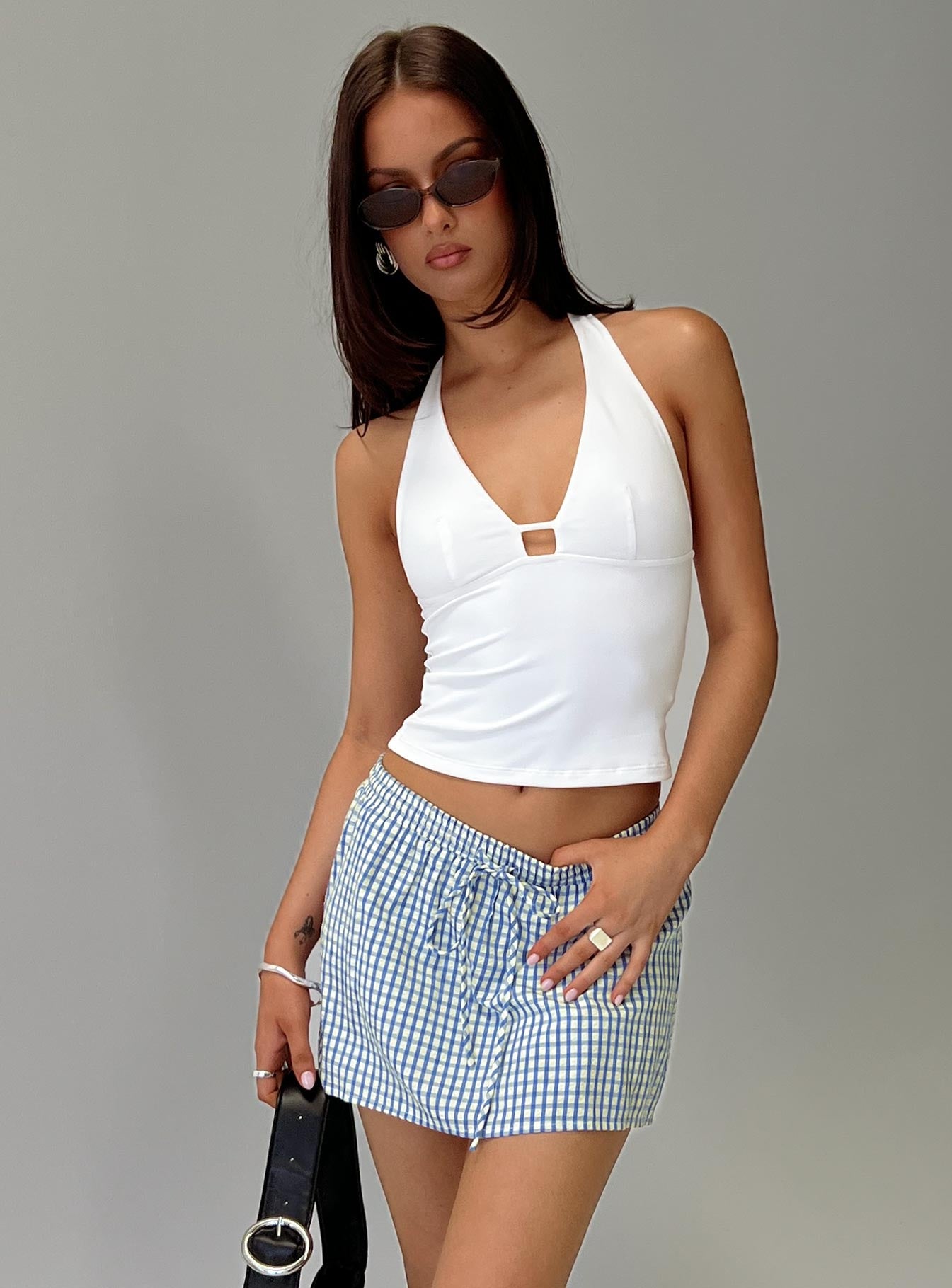 side view of model wearing Princess Polly Impress Me Halter Top White Full Sleeves Plunger 