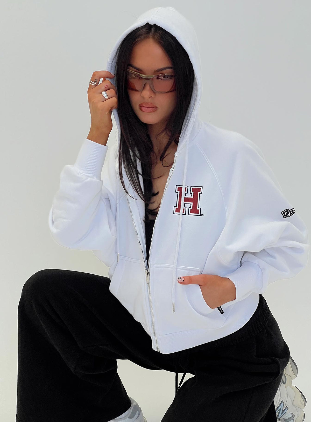 front view of model wearing Princess Polly Harvard Raglan Zip Up White / Red Jumpers 