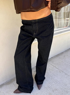 Showcasing the Buenos No Waist Low Rise Straight Leg Jeans Raw Denim Petite in womens-jeans with belt and gold stitching side view of model wearing Princess Polly