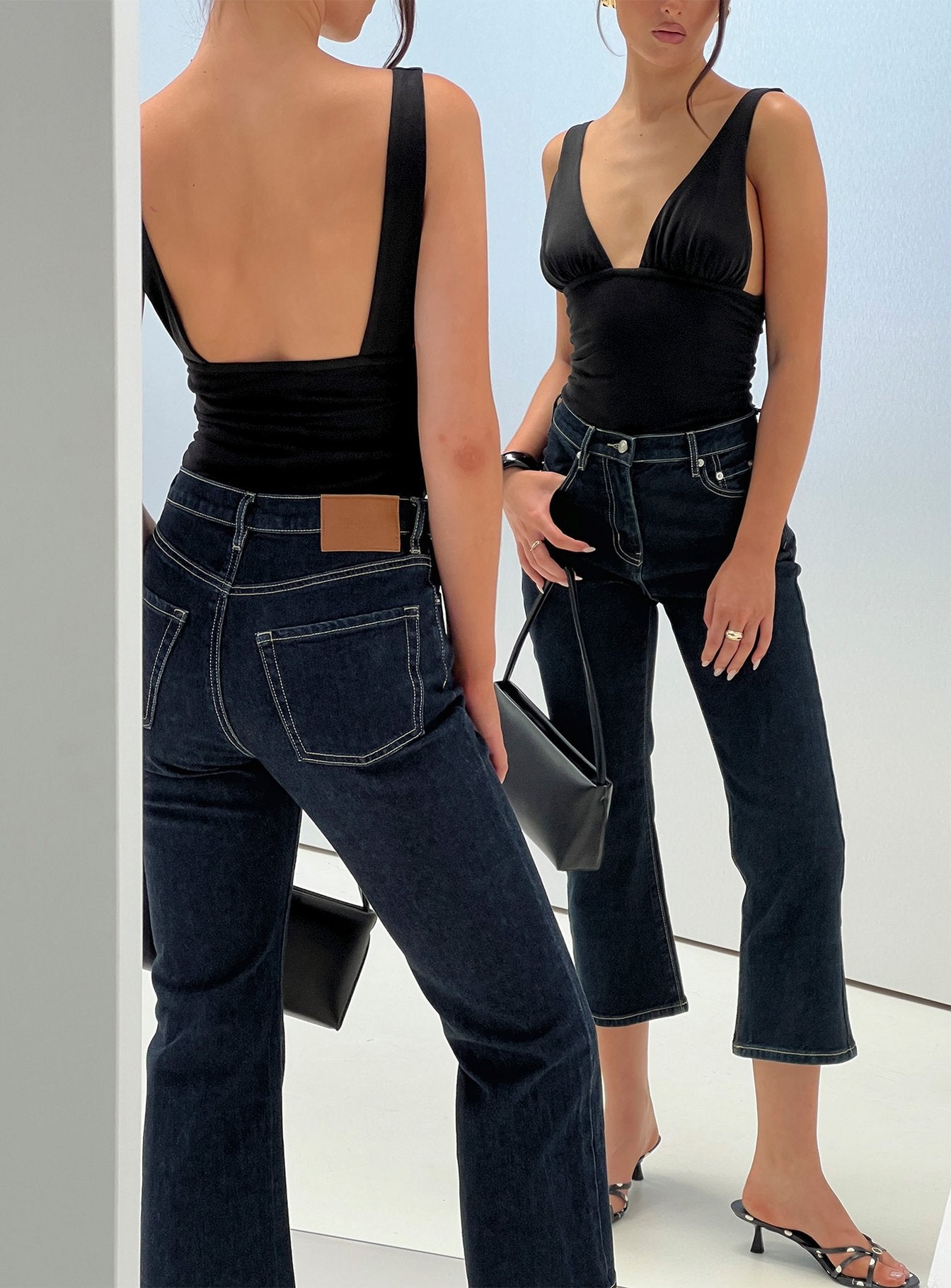 back view of model wearing Princess Polly Cindee High Rise Cropped Jeans Raw Indigo High Rise Jeans 