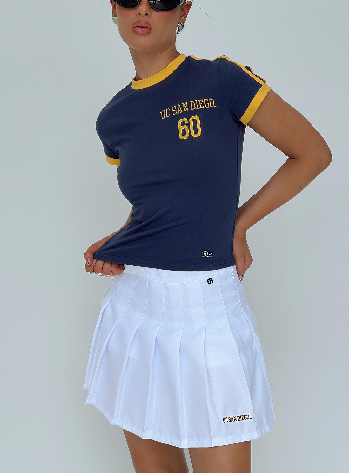 back view of model wearing Princess Polly UCSD Goalie Baby Tee Navy Short Sleeves Crew Neck 