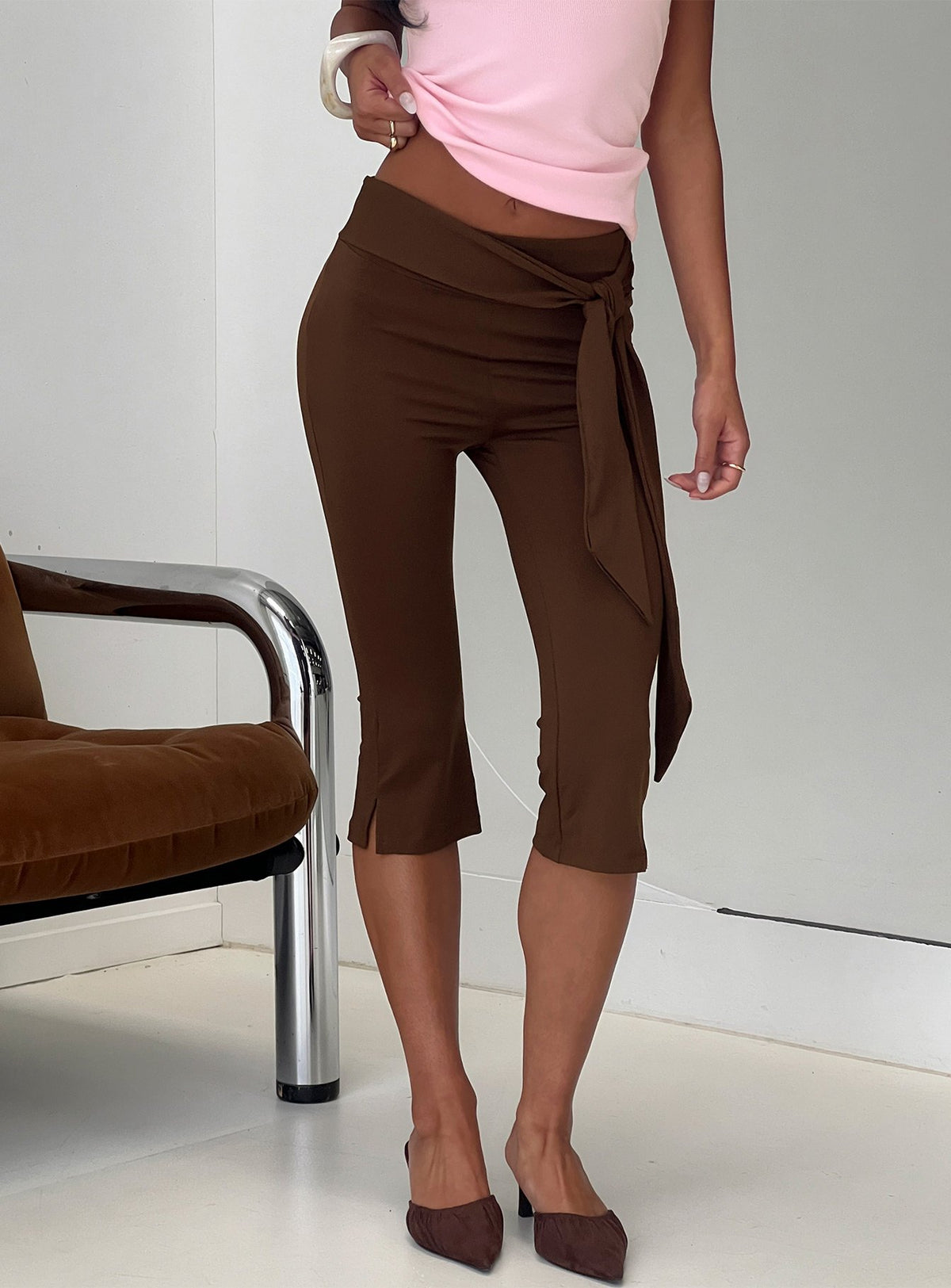 front view of model wearing Princess Polly Lizana Tie Side Capri Pants Brown Mid Rise Pants 