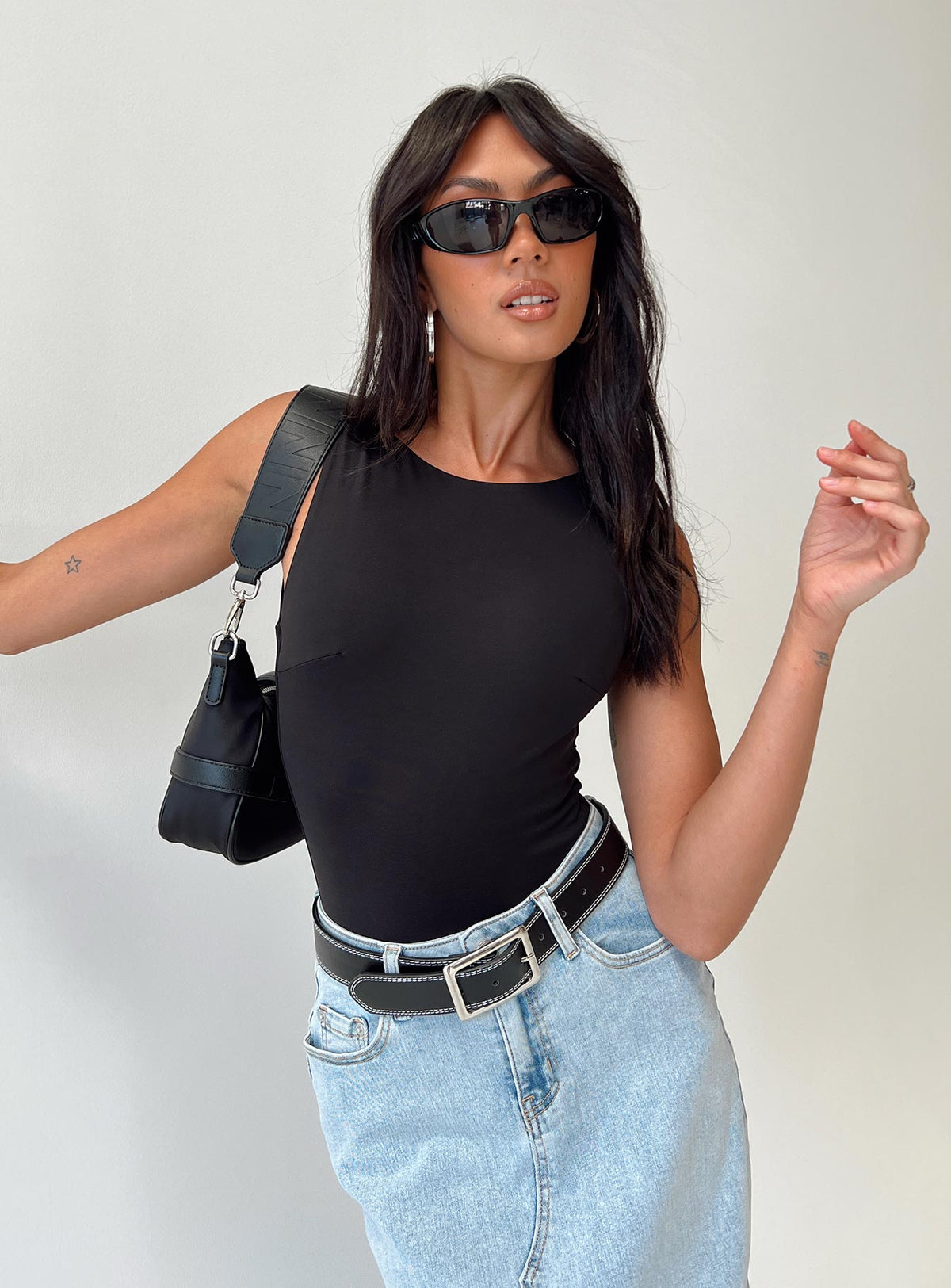 front view of model wearing Princess Polly Beresford Bodysuit Black Sleeveless Bodysuit 
