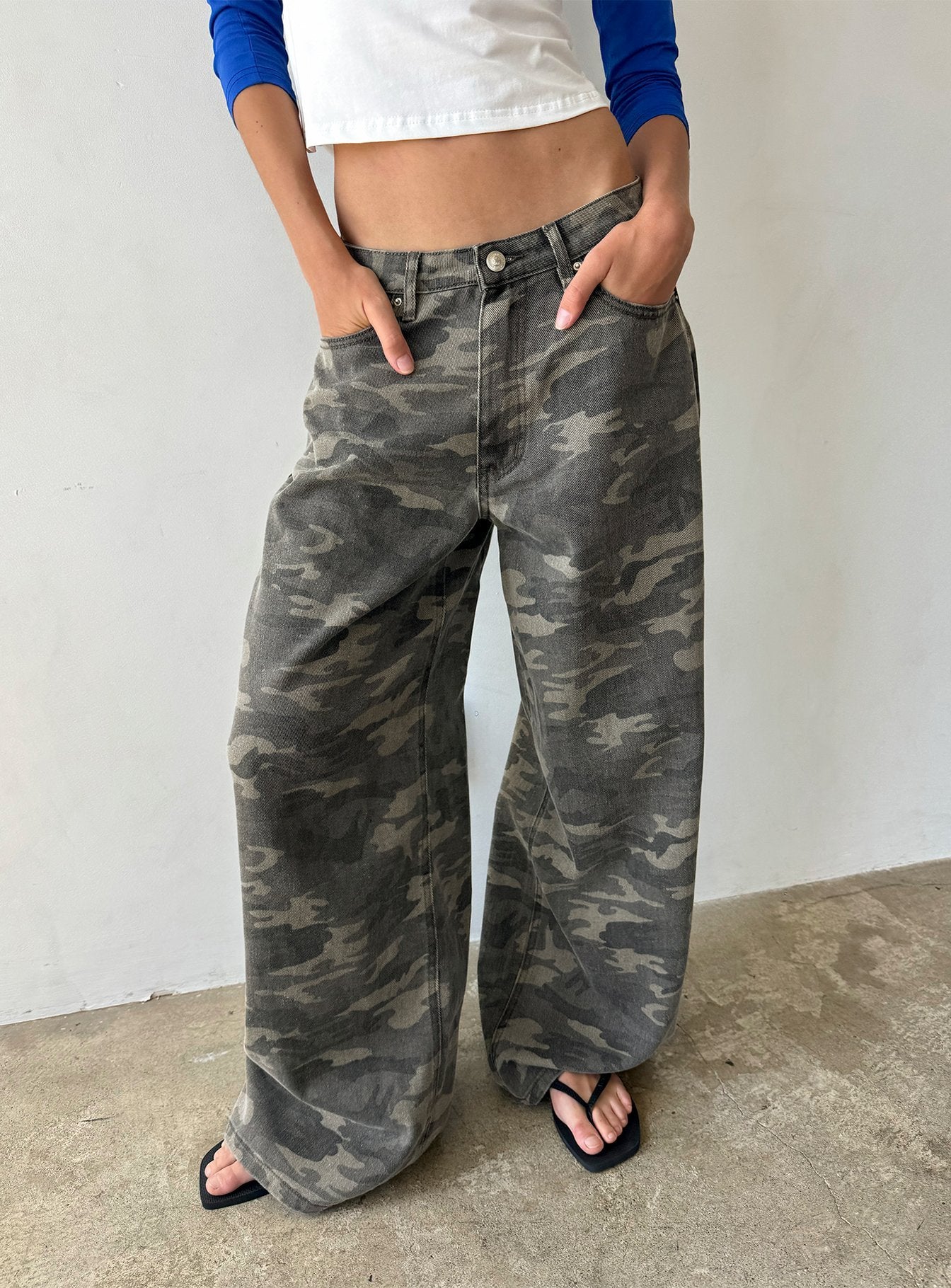 Showcasing the Naylor Mid Rise Wide Leg Jeans Camo in womens-jeans front view of model wearing Princess Polly