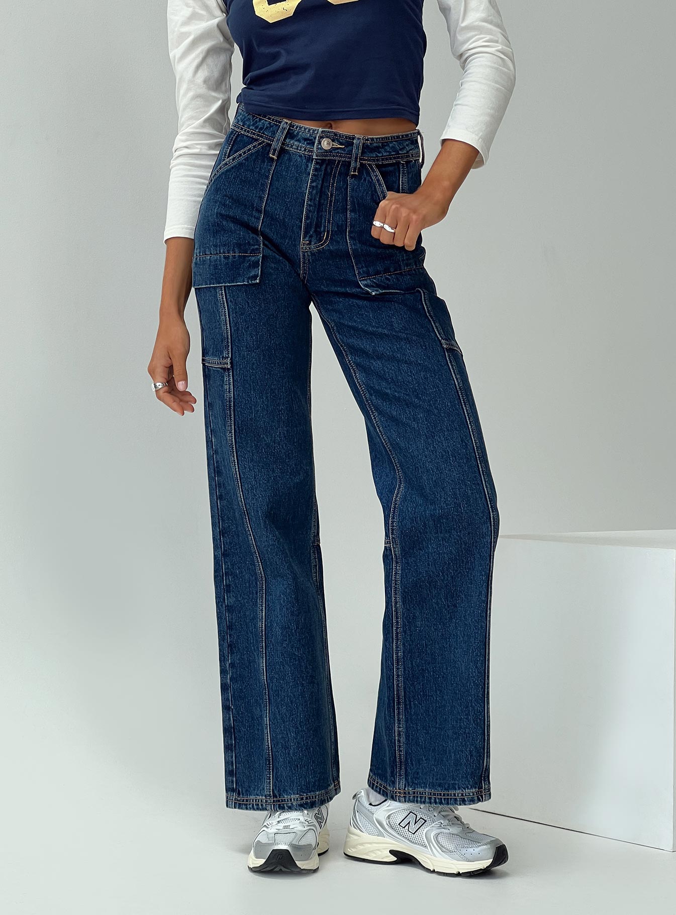 side view of model wearing Princess Polly Chad Cargo Jeans Dark Wash Denim Mid Rise 