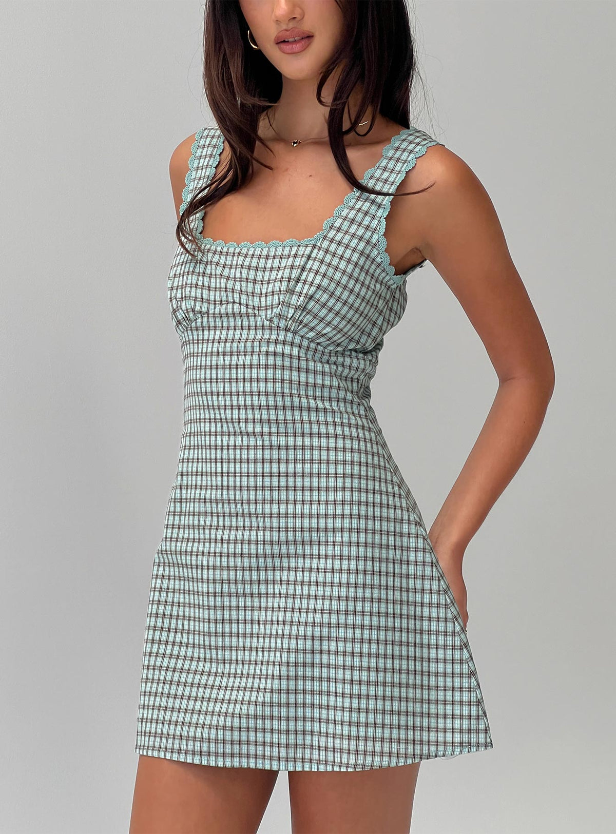 back view of model wearing Princess Polly Dasha Mini Dress Blue / Brown Check Square Neck 