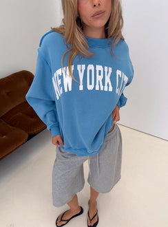 Showcasing the When In New York City Oversized Jumper Blue womens jumper in long fit front view of model wearing Princess Polly