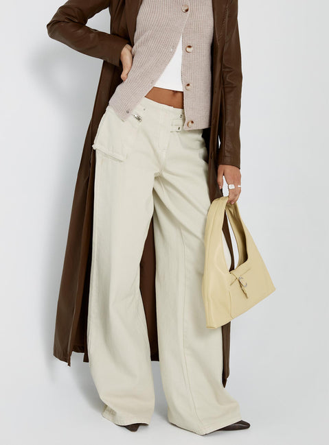 side view of model wearing Princess Polly Paltrow Cargo Jeans Cream Low Rise Jeans 