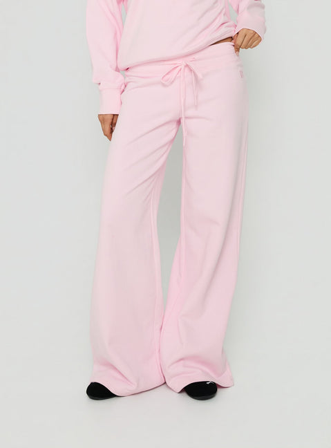 Featuring Dodie Wide Leg Pants Pink in womens regular pants with mid-rise front view of model wearing