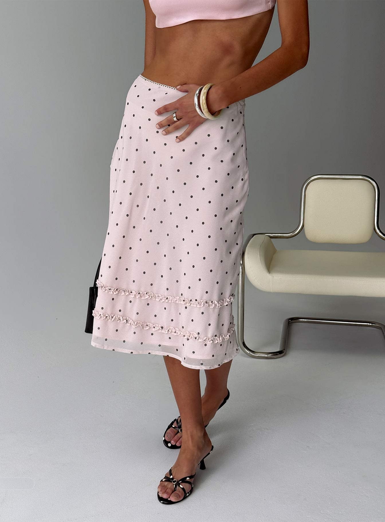   side view of model wearing Princess Polly Clarabella Frill Midi Skirt Pink Polka Dot Midi Skirts 