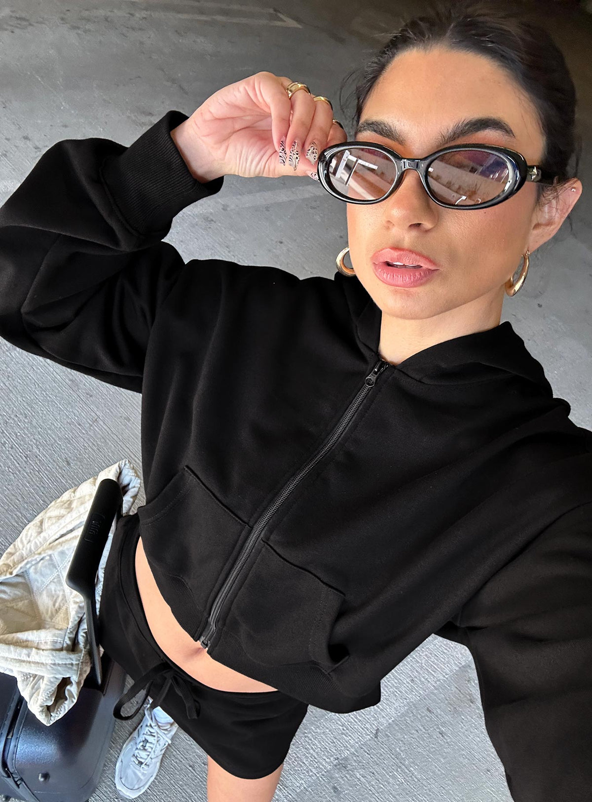 Showcasing the Revive Zip Through Hoodie Black in womens-jumpers with short length front view of model wearing Princess Polly